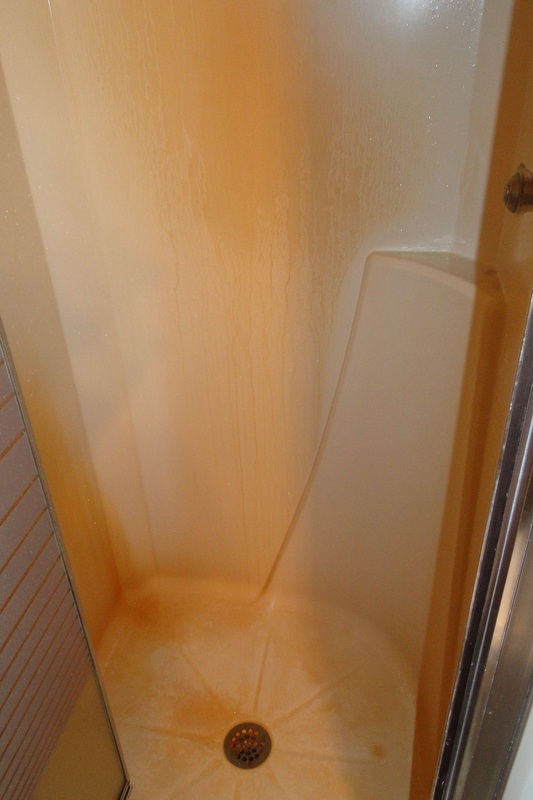 Norwex Before & After Descaler & Cleaning Paste removes rust on plastic shower surrounds